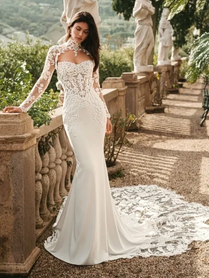 A bride wearing a lace wedding gown with a flowing train